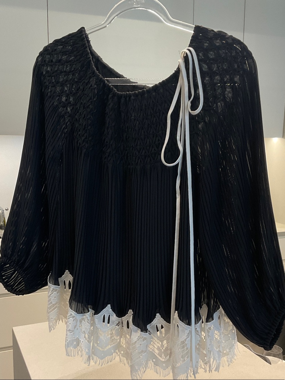Chloe Black Pleated Blouse with White Lace Hem